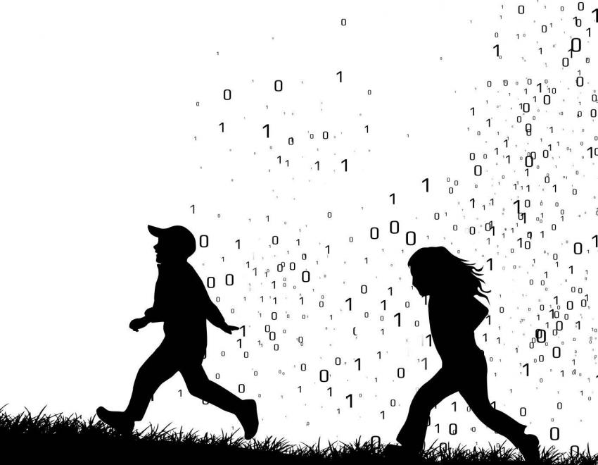 Silhouette of two children running through a cloud of ones and zeros. 