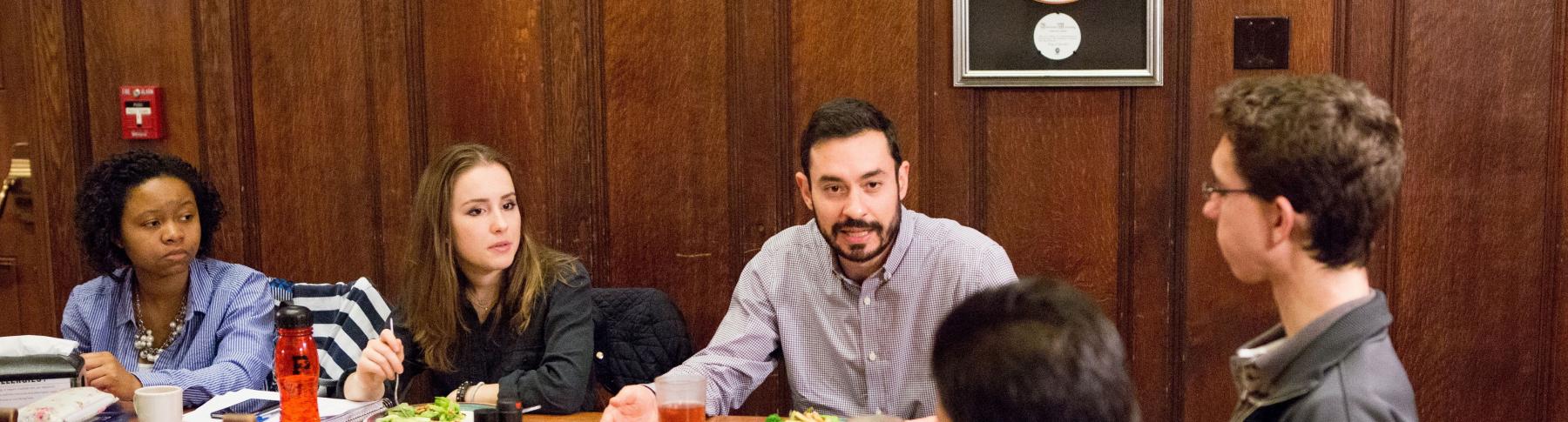 political science research areas Photo of Prof. Ali Valenzuela dining with undergraduates
