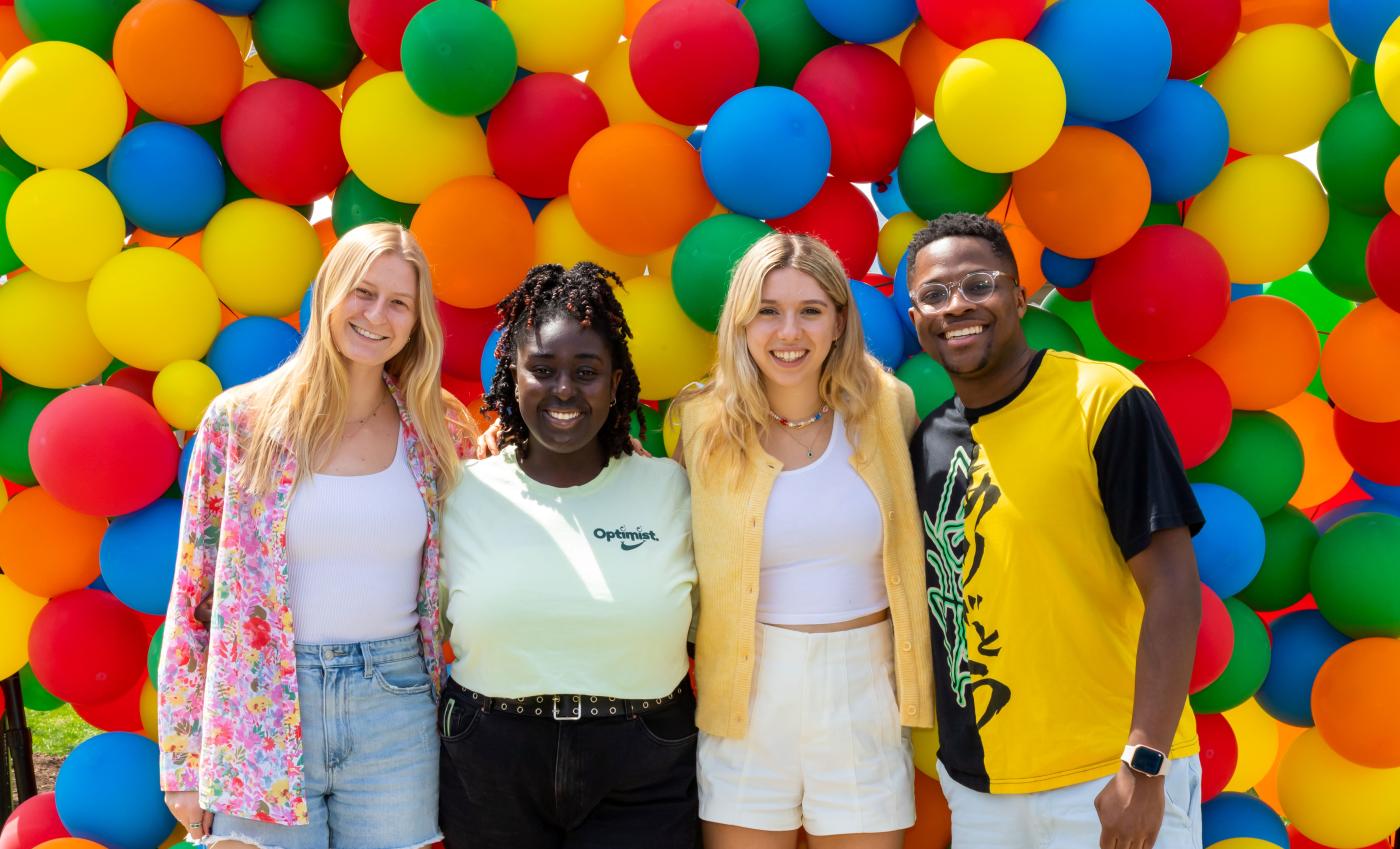 Undergrad BBQ 2022, students posing in front of balloons