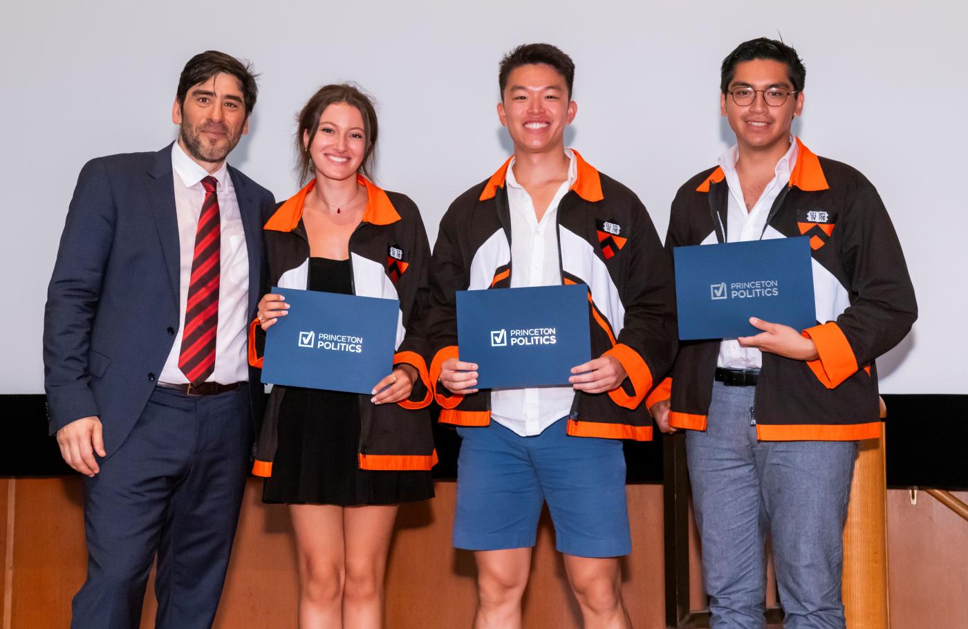 Three students receiving awards