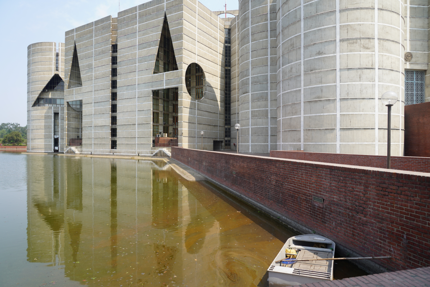 looming Parliament building in Dhaka