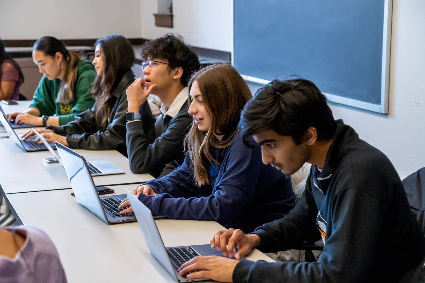 students listening to a lesson in class