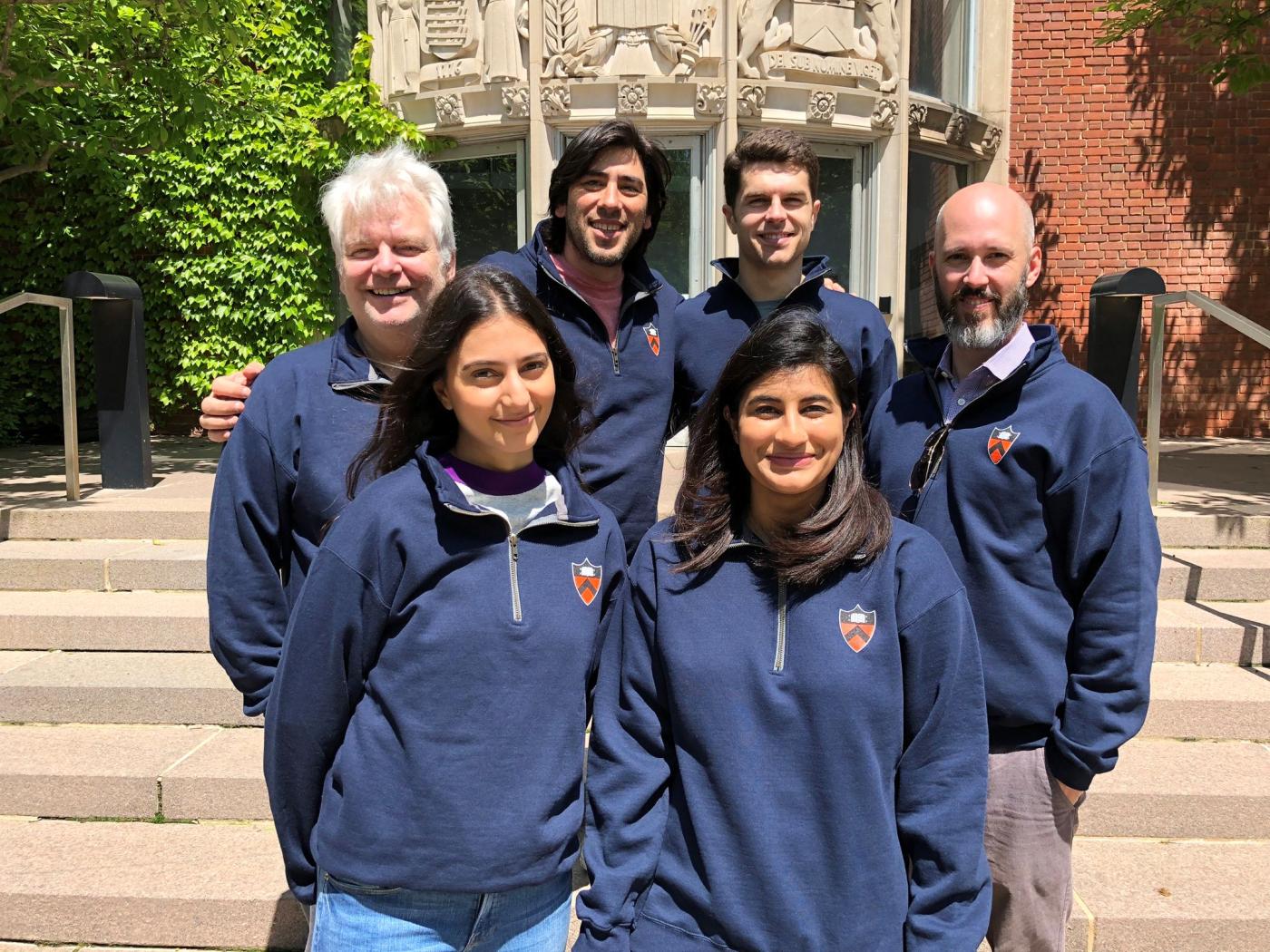 Students and faculty wearing matching sweatshirts