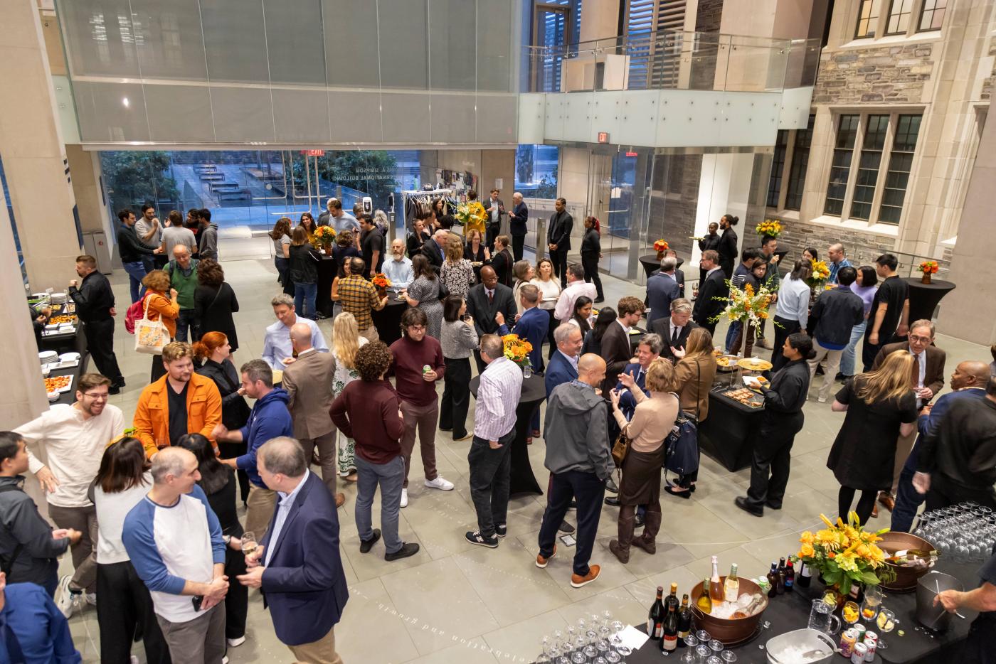 A crowd of Politics Department members gathering at a celebratory cocktail reception