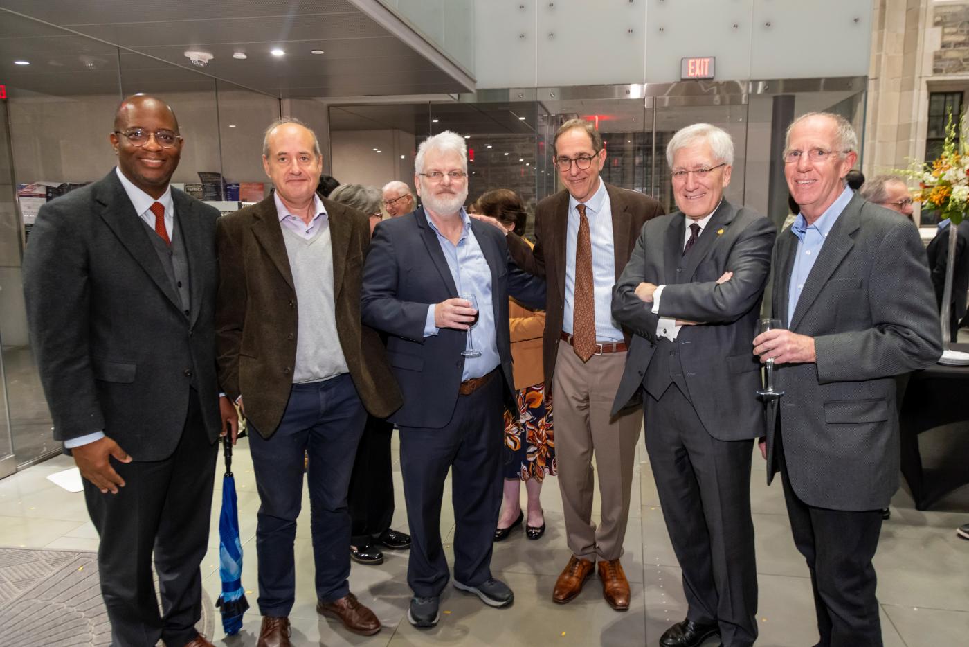 Politics Professors gather with University President and Dean of the Faculty at celebration