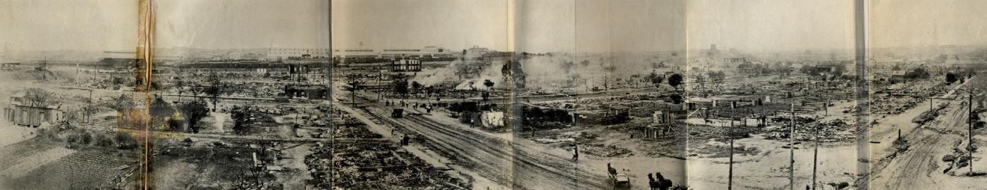 Taken from the southeast corner of the roof of Booker T. Washington High School, this panorama shows much of the damage within a day or so of the riot and the burning.  The road running laterally through the center of the image is Greenwood Avenue, the road slanting from the center to the left is Easton, and the road slanting off to the right is Frankfort.