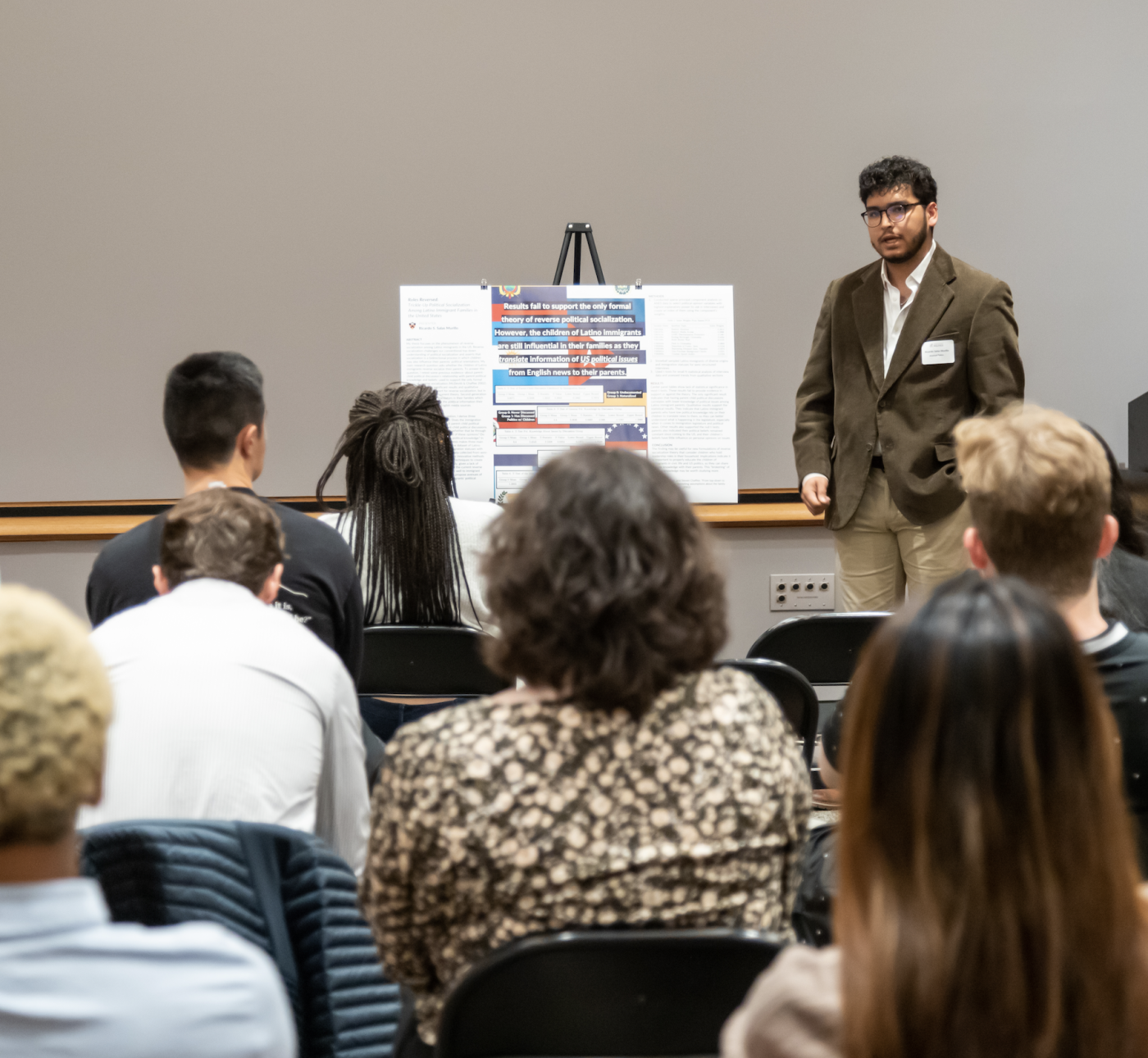 student presenting poster