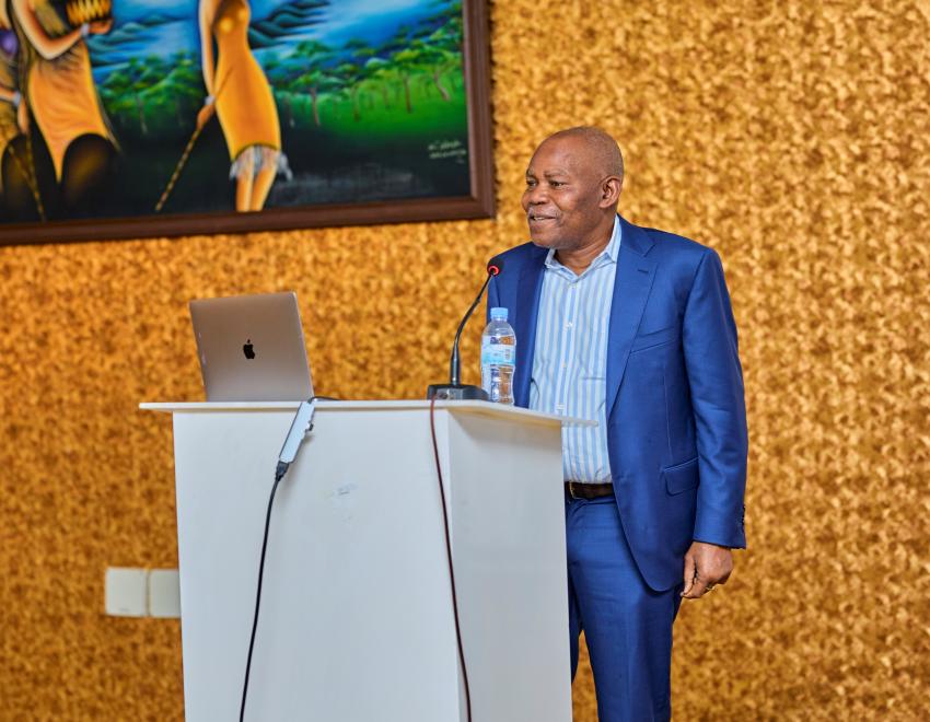 Professor Leonard Wantchekon standing at a podium speaking at the Conference of African Materials Research Society